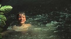Vintage 8 mm film: Children swimming in lake