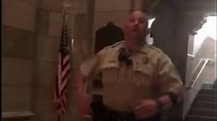 Off-duty cop, who moonlights as a singer, belts national anthem in empty courthouse