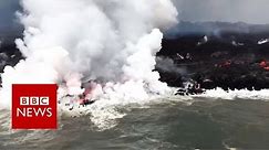 Molten lava meets the sea - BBC News