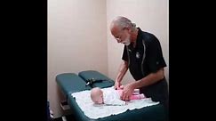 Cartersville chiropractor Dr. Steven Garber adjusts 2 month old infant with colic