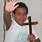 Kid Holding a Cross