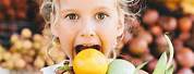 Kids Holding Fruit