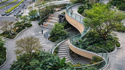 Spiral walkway surrounded by trees forms calm space in China