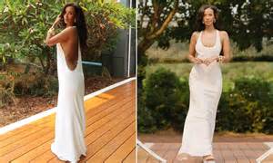 Maya Jama sets pulses racing in plunging white dress as she poses ...
