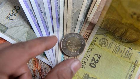 Rupee rises as RBI curbs speculation ahead of policy meet