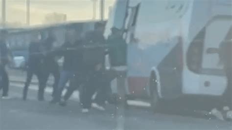 Celtic supporter left motionless on the ground after bus stormed by ...