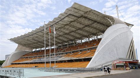 Distinct stadium structure in China stands with a massive roof design