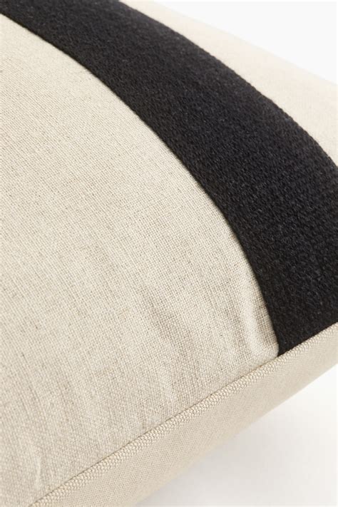 Light beige/Black Linen-blend cushion cover at H&M Home | H&M IN