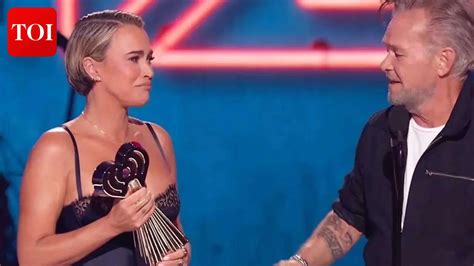 Teddi Mellencamp fights back tears presenting dad John Mellencamp with ...