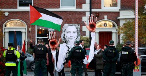 Four arrested after protests during Hillary Clinton visit to Queen’s ...