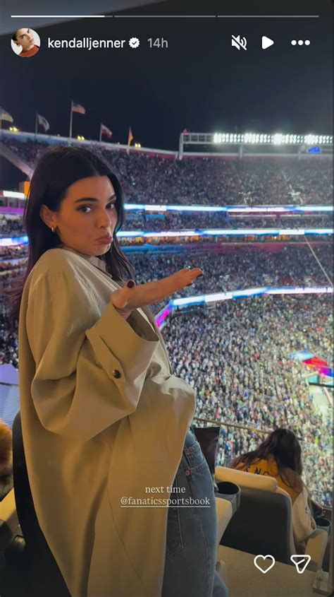 Kendall Jenner’s Super Bowl Outfit Included A Tie-Up Crop Top & Jeans