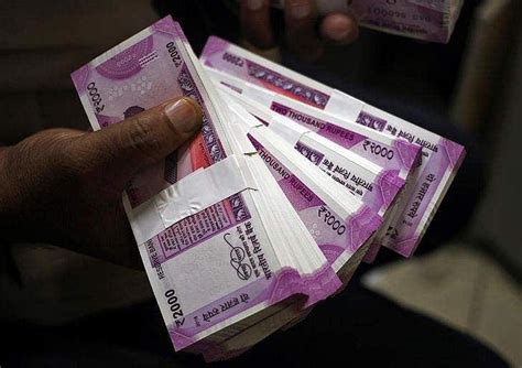 Rupee recovers from lowest level, gains 9 paise to 91.90 against US ...