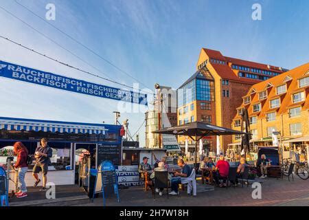 Rostock: fish snack seller from fishing ship, commercial buildings in ...