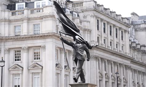 Is this London's latest Banksy? Mystery statue of man blinded by flag sparks speculation