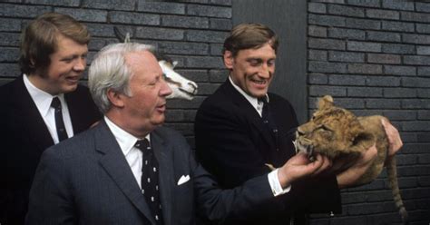 Willie John in his underpants, puffing on his pipe, hotel lobby ...