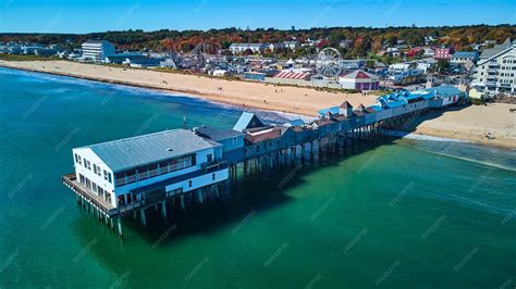 Premium Photo | Aerial of Old Orchard Beach pier in fall over Maine ...