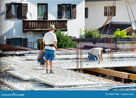 Workers Rivet a Concrete Slab on a Hardwood Floor at a Construction ...