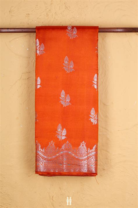 Raw Silk Saree In Rust Orange With Floral Buttas
