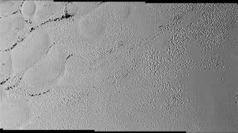 New image shows Pluto s puzzling patterns pits