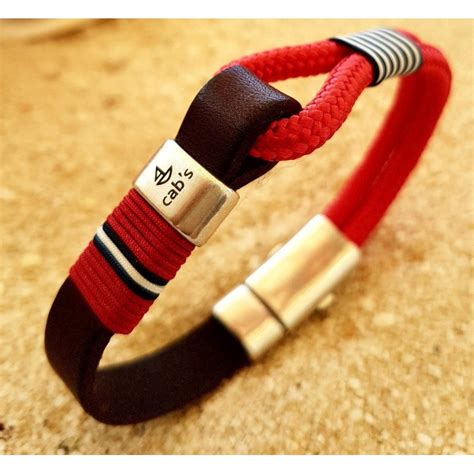 PULSERA MARINA BEACH SPORT SAIL, con cuero, cabo náutico rojo y bandera ...