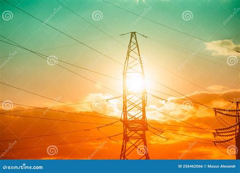 High Voltage Post and Power Lines at Sunset Electricity Pylons in a Row ...