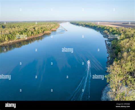 spring sunrise over the Missouri River with a fishing boat at Dalton ...