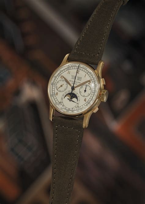 Reference 1518 | A pink gold perpetual calendar chronograph wristwatch ...