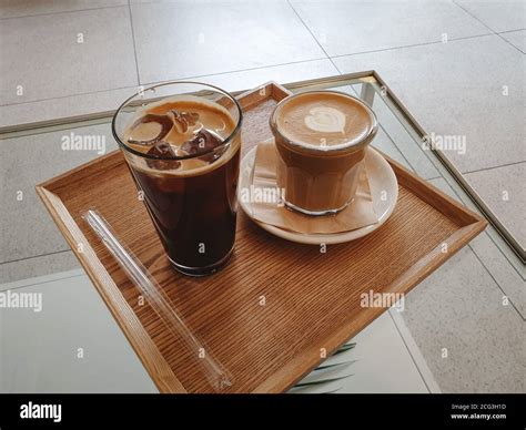 Iced americano and hot cafe latte. Americano is prepared by diluting an ...