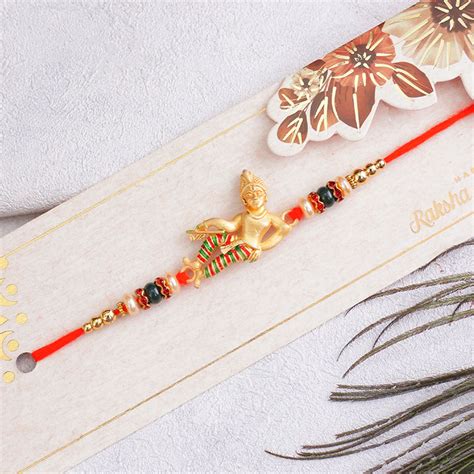 Send Golden Krishna Rakhi with Chocolates Combo Online | Rakhibazaar.com
