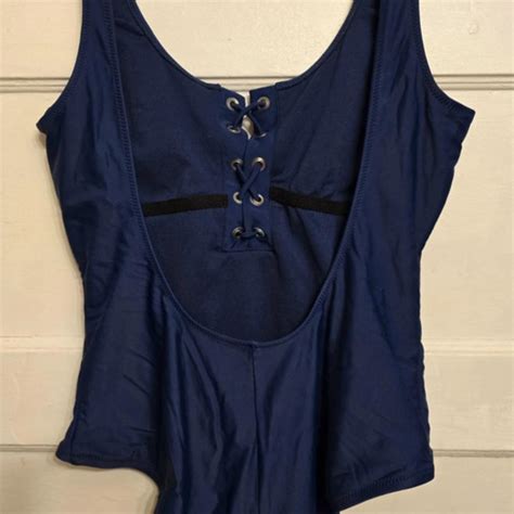 Navy bathing suit with laced bust and low-cut back.... - Depop