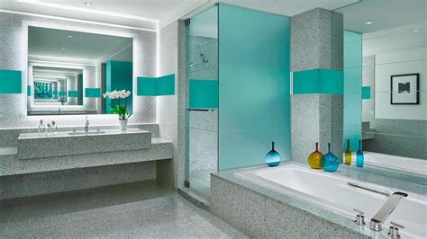 The Ritz-Carlton bath robes hanging in luxury bathroom