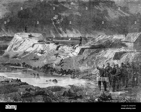Confederate soldiers surveying the damage after the battle at Fort ...
