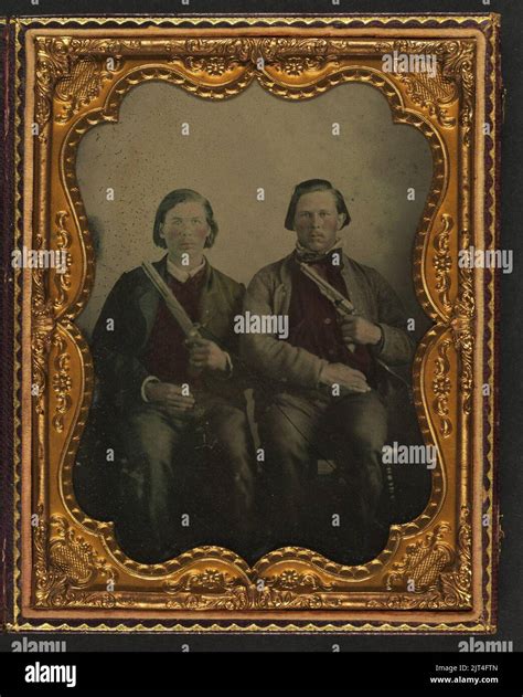 Two unidentified soldiers in non-regulation Confederate uniforms with ...