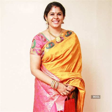 Singer Vinaya smiles for the cameras as she arrives for the marriage ...