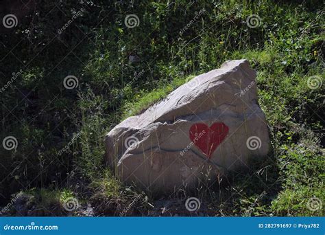Red Heart Painted on a Large Stone, a Huge Boulder in the Middle of ...