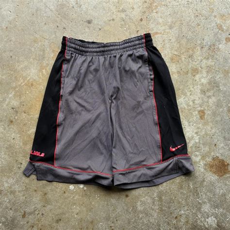 LeBron Nike baggy basketball shorts with red accents... | Depop