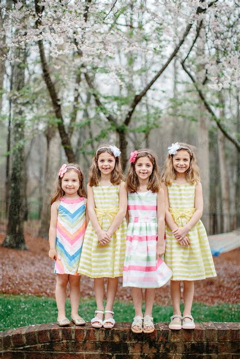 "Four Cute Young Girls Standing Together For A Group Photo" by Stocksy ...