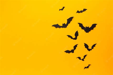 Download Black Bats Yellow Background Wallpaper | Wallpapers.com