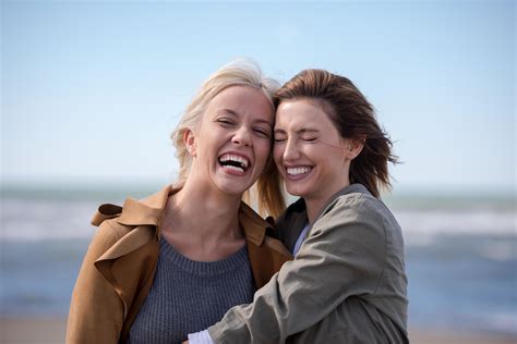 Women Smiling And Enjoying Life at Beach 12646479 Stock Photo at Vecteezy