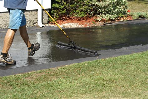 Appying driveway sealer - Watsonville Grading & Paving, Inc.