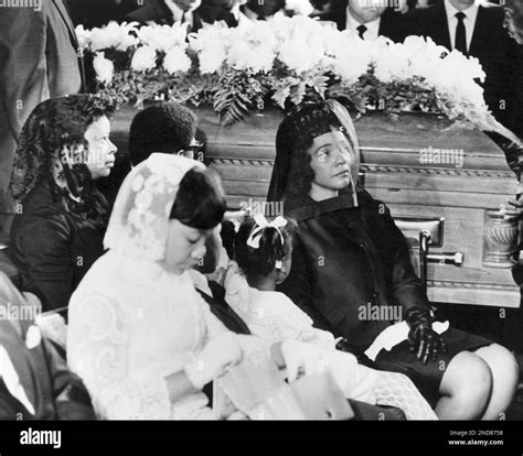 Coretta Scott King, widow of Dr. Martin Luther King, Jr., with two of ...