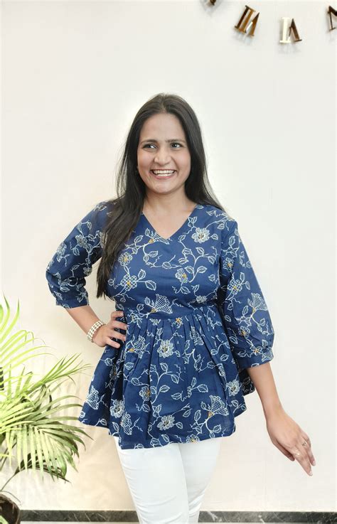 Dark blue with white floral peplum top – Masang
