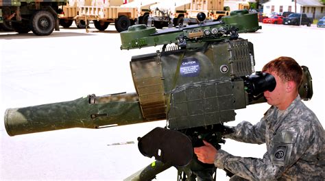 A paratrooper practices making targets on a BGM-71 TOW missile system ...