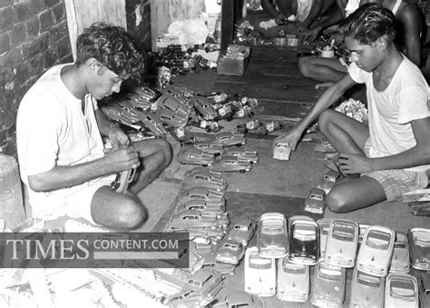 Toys Feature Photo Workers busy in making toy cars at a...