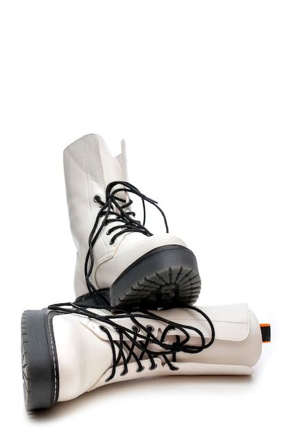Women's white boots with thick soles on a white background | Premium Photo