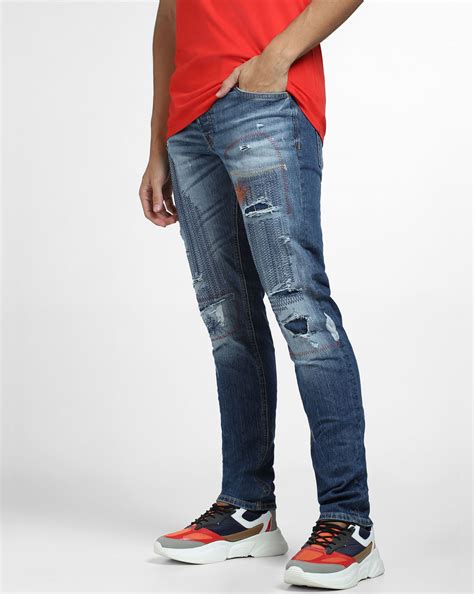 Blue Low Rise Distressed Glenn Slim Fit Jeans
