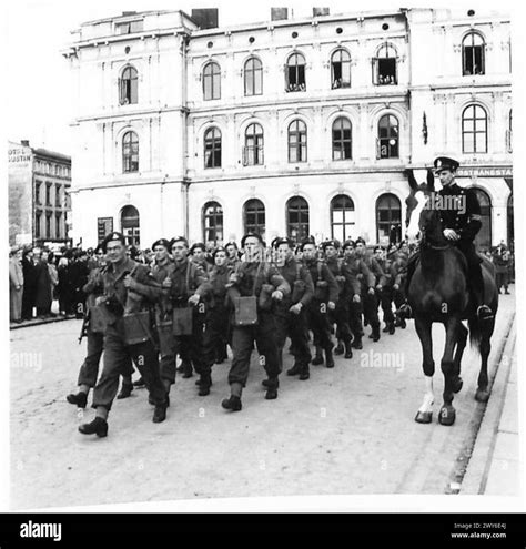 British Airborne Division troops leave Oslo station and march into the city during post-war ...