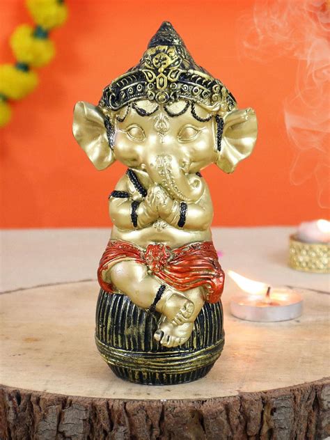 Buy | Metallic-Toned and Black Textured Bal Ganesha Idol Showpiece ...