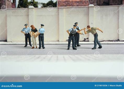 Miniature People Of A Girl Or Woman Arrested By Police And Military Security Officer Stock ...