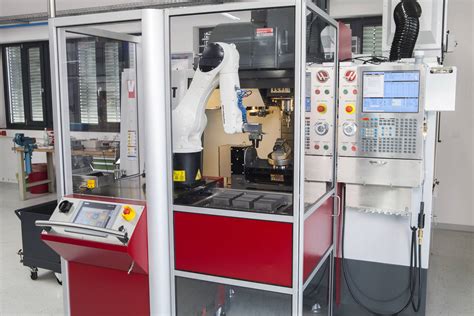 Automated robot cell for CNC loading and unloading | KUKA India